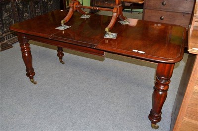 Lot 578 - A mahogany extending dining table of small proportions