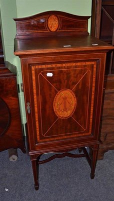 Lot 594 - An Edwardian inlaid music cabinet (no key)