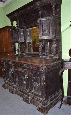 Lot 599 - Late Victorian carved oak sideboard