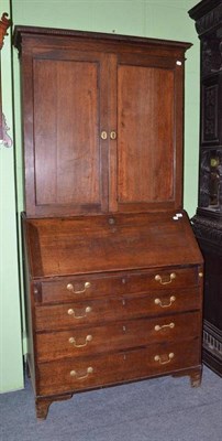 Lot 600 - George III oak bureau and associated top