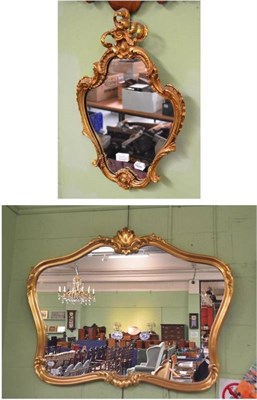 Lot 605 - A modern gilt framed shaped mirror and a modern gilt framed small mirror