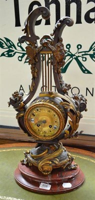 Lot 606 - A French bronzed mantel clock on a marble plinth