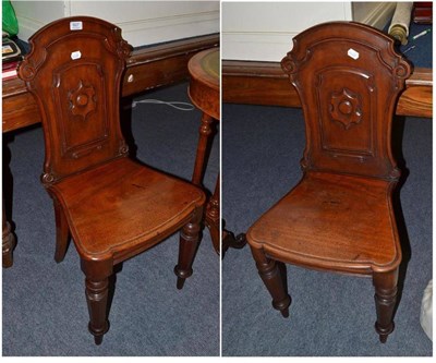 Lot 607 - A pair of 19th century mahogany hall chairs