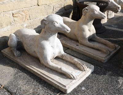 Lot 1229 - Pair of Composition Recumbent Greyhounds, 73cm...