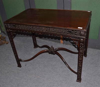 Lot 614 - A mahogany silver table in the Chippendale style with fret carved frieze and legs and...