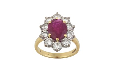 Lot 2269 - An 18 Carat Gold Ruby and Diamond Cluster Ring...