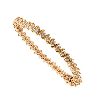 Lot 2283 - A Diamond Line Bracelet the thirty-eight round...