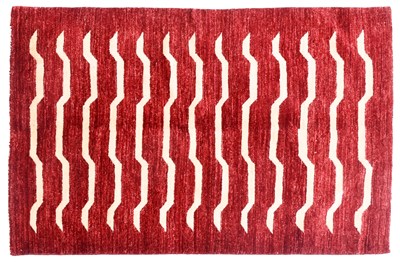 Lot 748 - A Modern Afghan Tiger Rug, on a red ground...