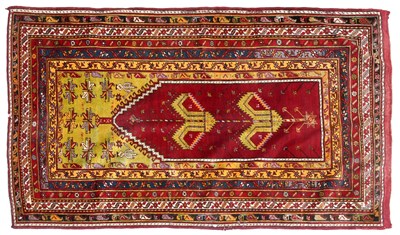 Lot 1301 - Turkish Prayer Rug, the cherry red field with...