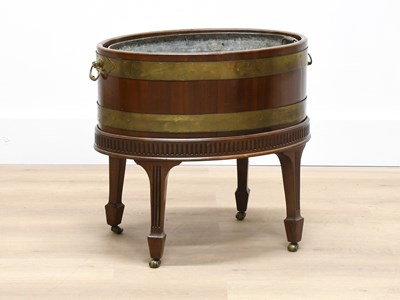 Lot 281 - A George III Mahogany and Brass-Bound Oval...