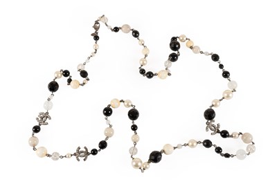 Lot 1056 - A Glass Bead and Simulated Pearl Necklace, by...