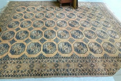 Lot 733 - An Eastern brown ground patterned carpet