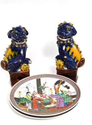 Lot 22 - A pair of Chinese Fo dogs and two Chinese plates