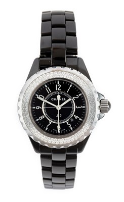 Lot 2377 - Chanel: A Lady's Black Ceramic Calendar Centre...