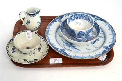 Lot 34 - Six pieces of blue and white ceramic - a sparrow beak jug, two tea bowls and saucers and tin glazed