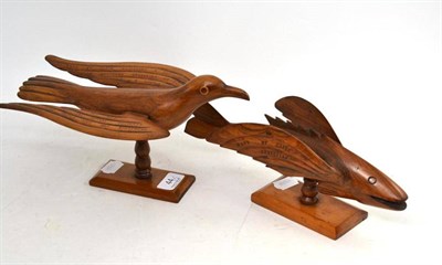 Lot 44 - A carved and inscribed Pitcairn Islands model bird on stand and a similar flying fish