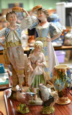 Lot 50 - A pair of bisque figures of a boy and girl, another girl with chickens, two Beswick birds and a...