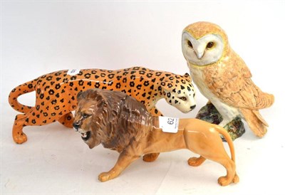 Lot 62 - A Beswick owl, lion and leopard (3)