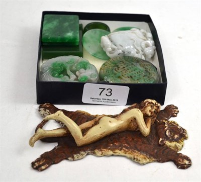 Lot 73 - Nine items of jadeite, and a metal nude on a tiger skin rug