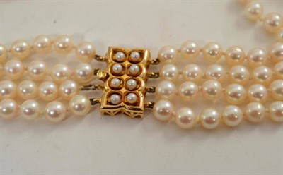 Lot 74 - A four strand pearl choker with 9ct gold jet clasp