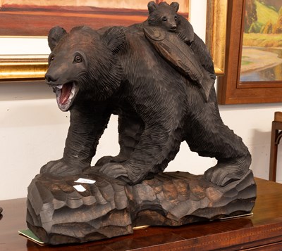 Lot 1305 - A 20th Century Black Forest Style Carved Bear,...