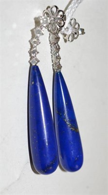 Lot 87 - A pair of lapis lazuli type stone and diamond drop earrings