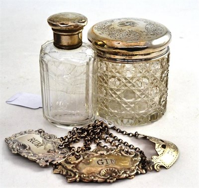 Lot 89 - Four assorted decanter labels and two silver topped jars