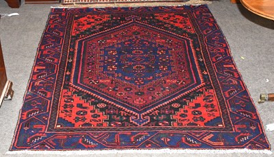 Lot 1099 - Hamadan Rug, the serrated lozenge field framed...