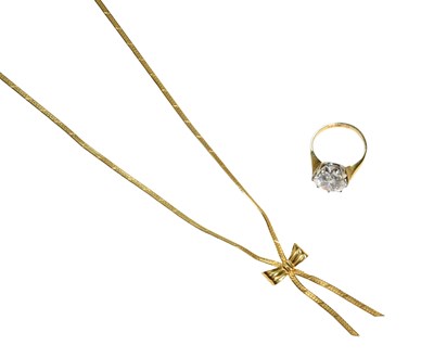 Lot 491 - A 9 Carat Gold Cubic Zirconia Solitaire Ring,...