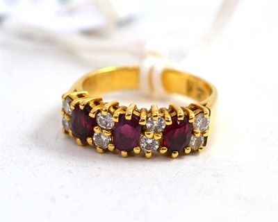 Lot 106 - A ruby and diamond ring stamped '18CT'