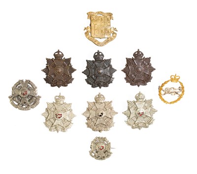 Lot 129 - Ten Badges to the Border Regiment, including a...