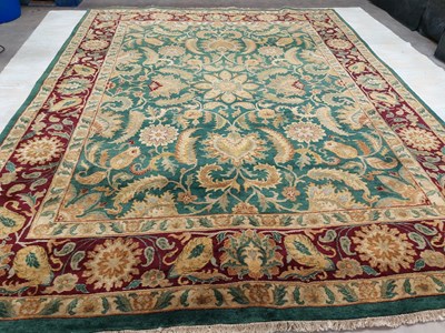 Lot 1109 - An Indian Chobi Carpet, the emerald green...