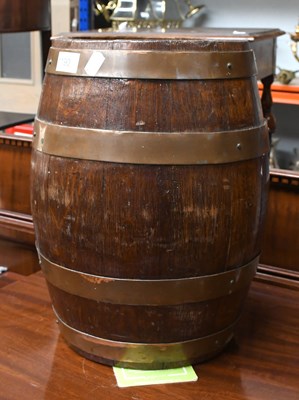 Lot 1377 - A Coopered Staved Oak Barrel, with four copper...