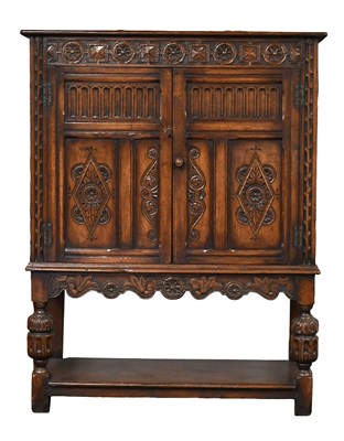 Lot 1166 - A 20th Century Carved Oak Cabinet on Stand,...