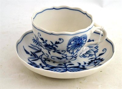 Lot 133 - A Meissen onion pattern cup and saucer