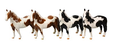 Lot 254 - Beswick Pinto Ponies, comprising: first and...