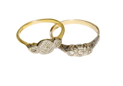 Lot 509 - A Diamond Three Stone Ring, the white plaque...