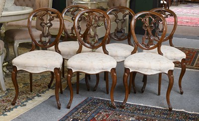 Lot 1358 - A Set of Six Victorian Carved Walnut Balloon...