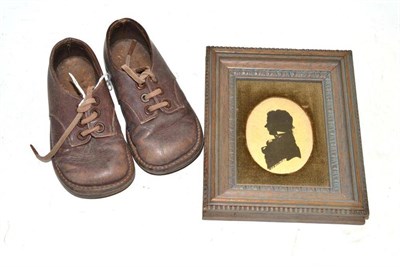 Lot 157 - A framed portrait miniature and pair of children's shoes