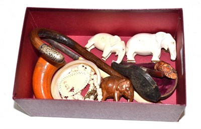 Lot 158 - Early 20th century carved ivory elephants, pipes, parasol handle etc