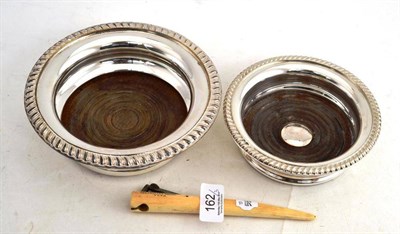 Lot 162 - Two plated bottle coasters and an early 20th century ivory cigar cutter, inscribed 'Treasurers...