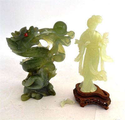 Lot 164 - Two Chinese green hardstone figures, one with wood stand