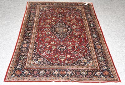 Lot 1120 - Kashan Part-Silk Rug, the blood red field...
