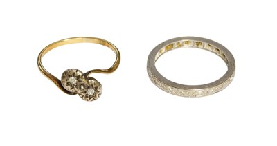 Lot 504 - A Diamond Eternity Ring, finger size N (a.f.);...
