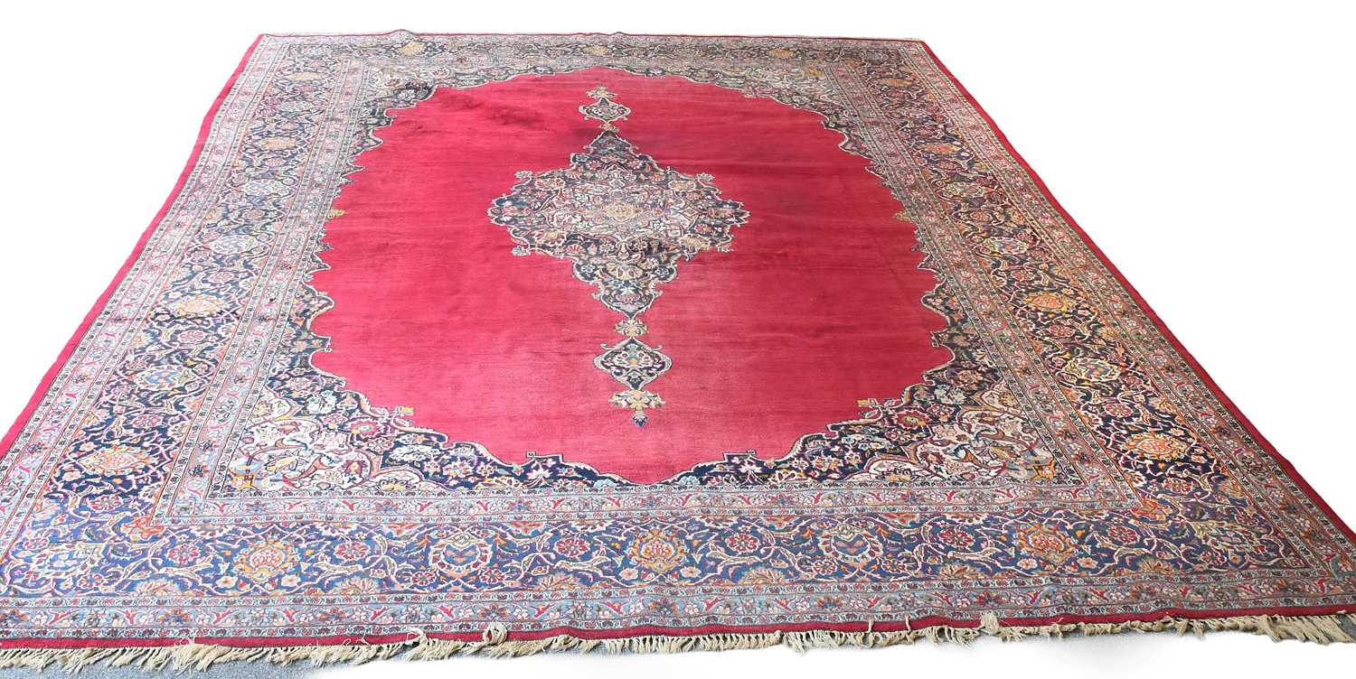 Lot 1138 - Kashan Carpet, the plain raspberry field