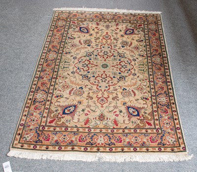 Lot 1297 - Tabriz Rug, the ivory field of meandering...