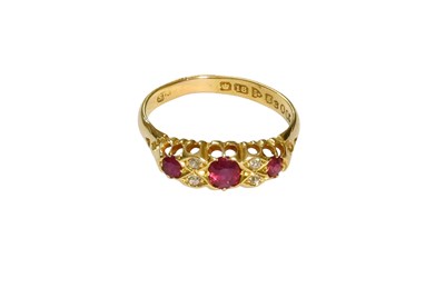 Lot 526 - An 18 Carat Gold Ruby and Diamond Ring, three...