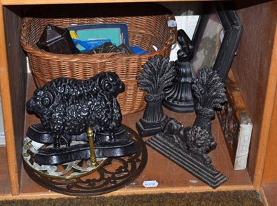 Lot 181 - Metalware and sundry items comprising: two pairs and a single cast-iron door stop, iron lion,...