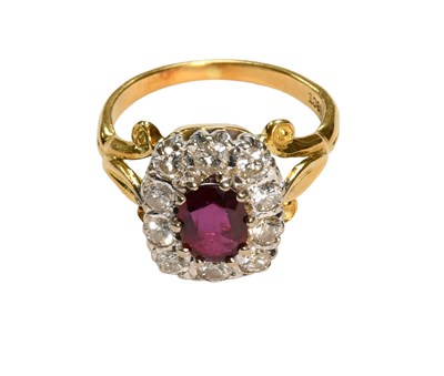 Lot 450 - A Red Stone and Diamond Ring, the oval cut red...