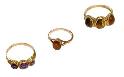 Lot 462 - A 9 Carat Gold Amethyst Three Stone Ring,...